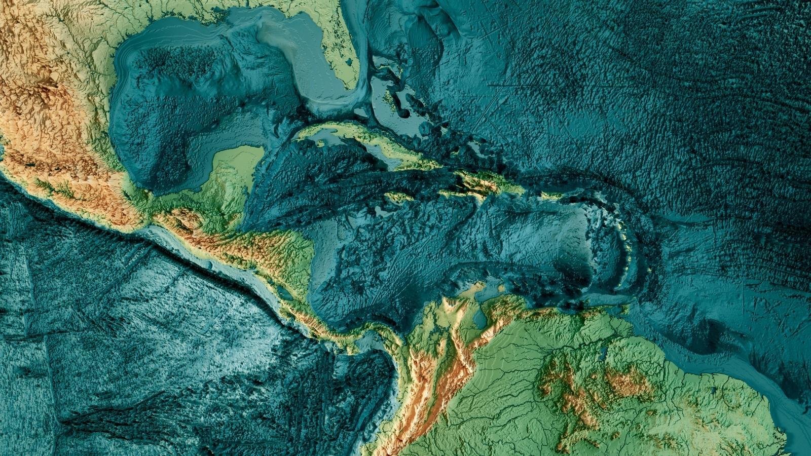 Topographic map of Central America and the Caribbean, showing ocean depths and land elevations. The tones range from deep blues to warm browns, highlighting terrain contrast.